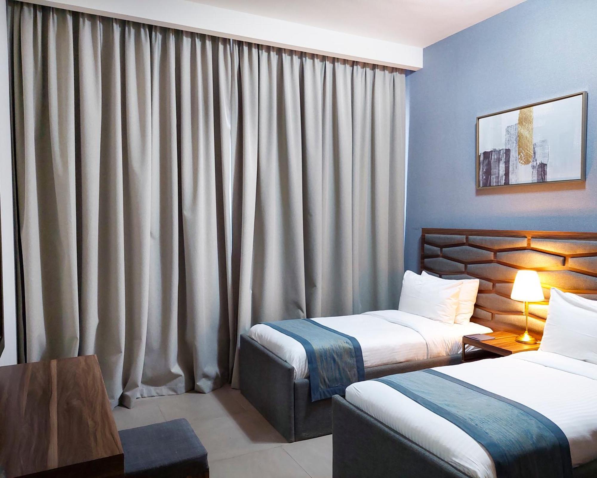 Luxe Grand Hotel Apartments Sharjah Eksteriør bilde A bedroom at the hotel